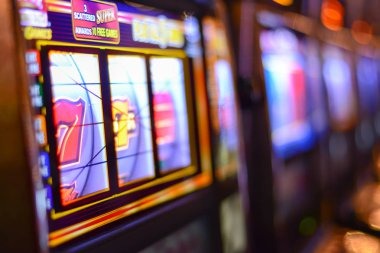 Jewels of Prosperity slot game interface showing five reels with gemstone symbols